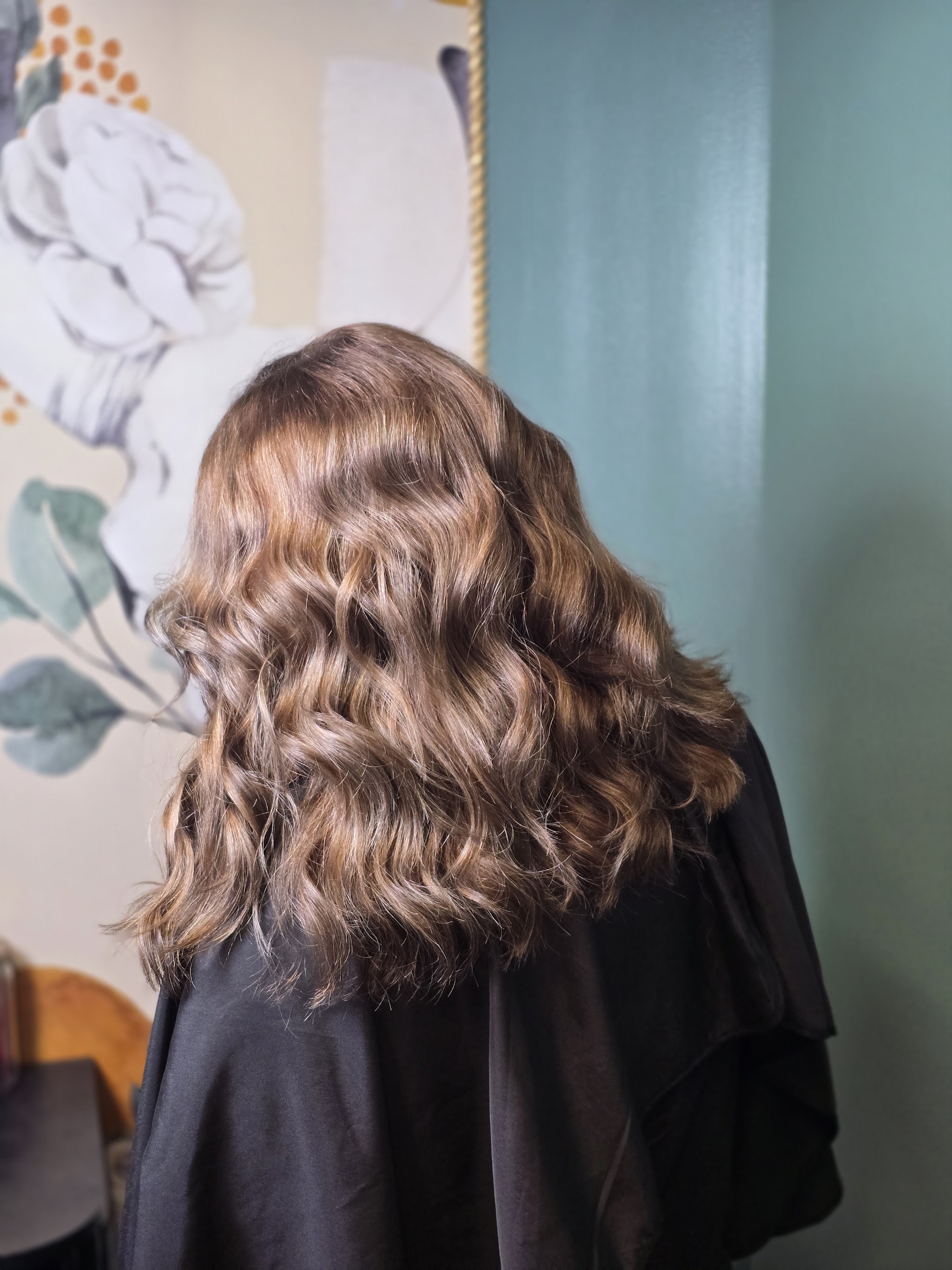 Brunette hair styled in loose waves